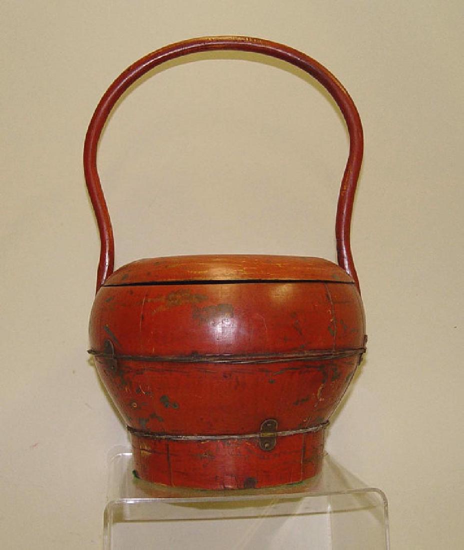 Chinese Wooden Metal Lunch Box Pail Basket 19th Century: Hand crafted 19th Century Chinese wooden basket-inspired lidded lunch pail of bulbous form, bound with ornate wound metal wire and brackets, with aged rustic red painted surface in excellent original