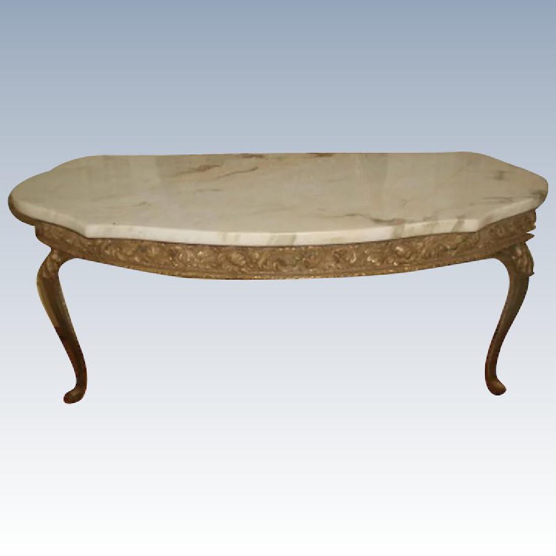 Italian Console Table Marble Top Gilt Early 1900's: Early 1900's Italian console table with attached marble top in antique cream background and camel and light brown veining with a hint of pink in some veins. Ornate gilt wood apron depicts acanthus lea