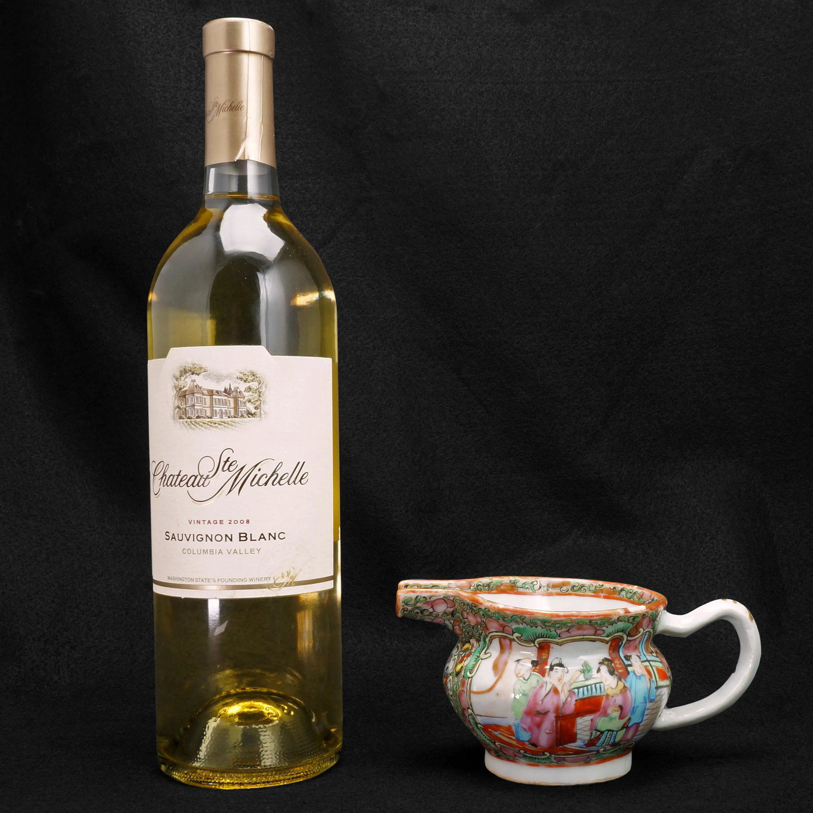 Chinese Rose Medallion Creamer 2nd Half 19th Century: A colorful early rose medallion porcelain design that is intricate with much hand work. The creamer is molded in the shape of a European creamer with hog nose spout. It has been painted in polychrome 