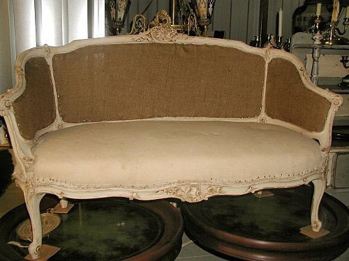 Carved Settee Sofa Louis XV Hand Made 19th Century : Louis XV hand made and carved antique white or light cream settee,sofa from 19th century France. Scalloped frame with flared low arms. Acanthus leaf carving along the header,apron and legs with interm