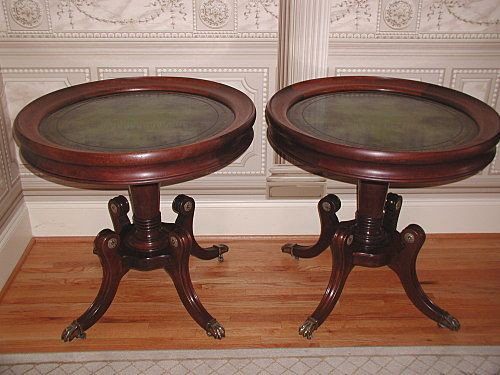 Mahogany Leather Tables Fabulous Pair Brass Rosette: Pair of magnificent round mahogany tables with dark green leather tops mottled with black and gold tooling from the early 1900's. Italian flair with tag on the bottom of one reads "Leonardo Furniture 