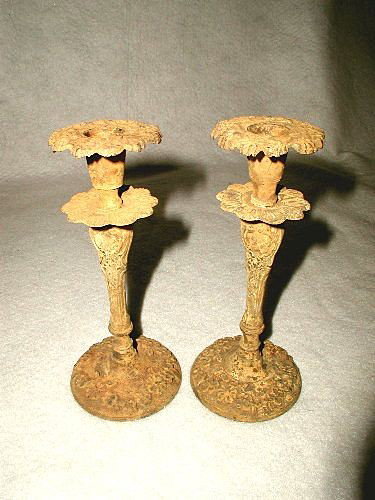 French Metal Candlesticks Metal Crusty Yellow Earl: Pair of early French 1900's yellow crusty metal candle holders or candlesticks are designed with raised floral on the base and around the candle hole. Swags and floral on the high pedestals. Starburst