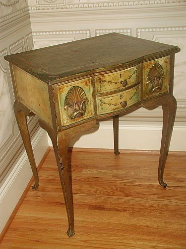 Italian Desk Table 18th Century Hand Made Painted: Outstanding Italian 18th century small desk or table completely hand made and carved. The piece is painted with a palette of colors,the top a mixture of yellow/brown and a bronze hue with a small band