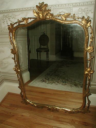 French Gilt Mirror Carved Acorns Oak Leaves On Wire: Gorgeous large gilt mirror from France 19th century with a grand patina to the aged gilt. Has been hand carved depicting bunches of oak leaves intermittent with a cluster of two acorns on heavy wire w
