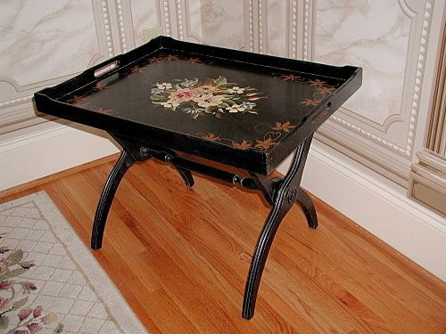 Decorative Tray Table Large Wooden Hand Painted Wi: Extra large early 1900's decorative black wooden tray table is hand painted with a center floral spray of rose,pink,blue,cream,rust and green. The rectangular tray has a deep lip and two open handles