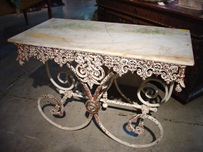 Antique Pastry Table from France: Antique Pastry Table with Ornamented Cast Iron Base and Marble TopOrnamented Cast Iron Base and Marble Top Ð Chipping to paint; One corner finial missing; Ð 19th C. This lovely antique French pastry