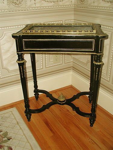 French Ebonized Planter Ormolu Mounts Napoleon III Mid : Handsome Napoleon III black ebonized high planter from France mid 19th century has bronze ormolu elongated mounts on each of the reeded legs with bronze collars on each knee. Matching bronze gradoonin