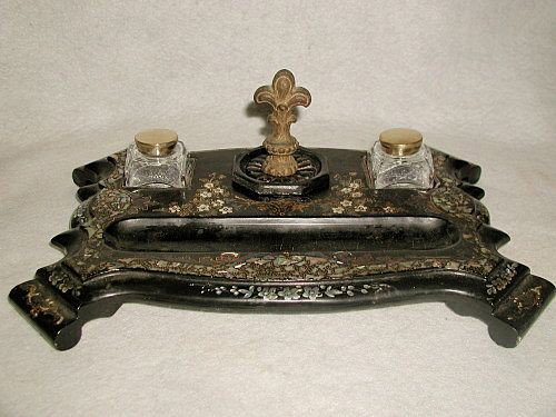 Papier Mache Inkwell Dual Inlaid Hand Painted France 19: Gorgeous papier mache double inkwell from 19th century Louis XV France. Inlaid with beautiful tones of mother of pearl and hand painted with gilt scrolling and floral. Four large graceful raised feet.