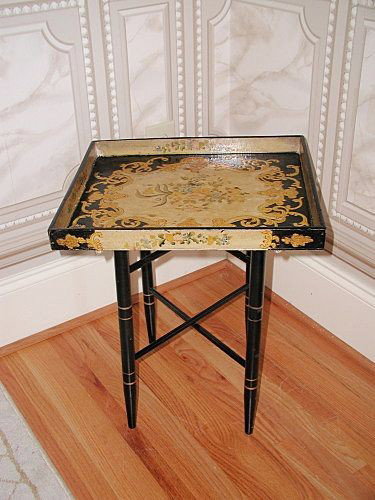 French Tray Table Papier Mache Early 1900's Hand Painte: Vibrant coloring in this hand painted French papier mache small tray table early 1900's. Yellow,blue,cream rust and green swirls and floral set against a black background. The design extends to all fo