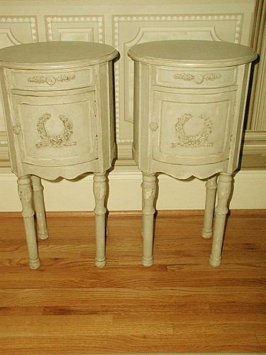 French Side Tables Hand Carving Painted Early 1900's: Pair of round unusual French side tables,night stands or end tables from early 1900's. Painted many years prior in cream/light gray with a slight texture due to antique brown waxing which has accented