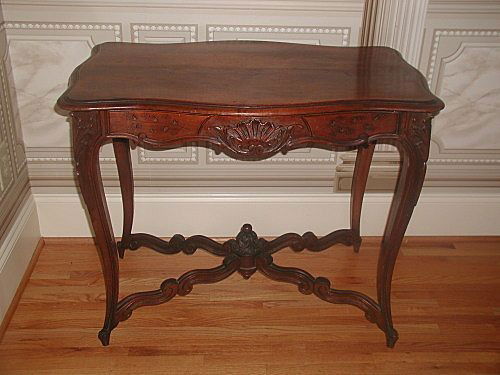 French center table walnut hand carved 19th century han: Very handsome hand carved French mid 19th century center table of walnut. Designed with one drawer at the more narrow end so that can be used between two chairs or long ways along a wall or out in a r