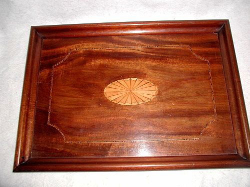 English Inlaid Tray Large 19th C Mahogany Satinwood: Large mahogany tray from England 19th century with gorgeous satinwood oval medallion in century. Additional inlay of fruitwood and ebony forms a small band,indented at the corners framing the medallio