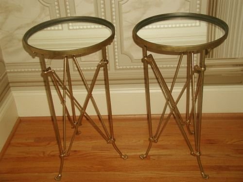 French Campaign tables mirrored gilt metal early 1900's: About the Item: Pair of gilt metal early 1900's French Campaign side tables. Each have mirrored tops in excellent condition as are the tables themselves.Gilt apron surrounds each top. Stand on three l