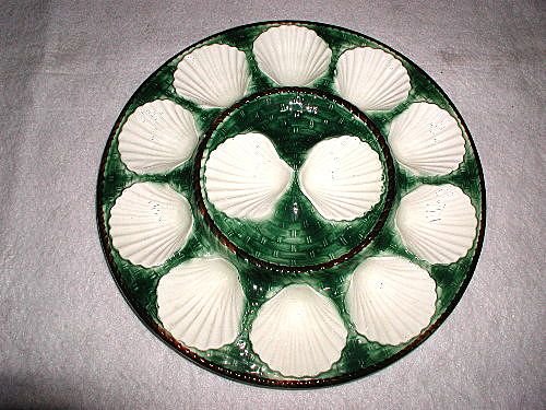 Master oyster platter 19th century Longchamp majolica: About the Item: 19th century,well known, Longchamp master oyster platter or tray of French Majolica has beautiful deep green basket weave design surrounded by dark brown rope motif. the 12 oyster well