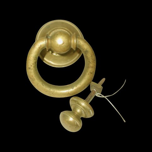 Large Door Knocker Brass 19th Century England: Large English 19th century brass door knocker with multi-tiered round brass plate and loop design. Complete with door knob style knocker plate. Small beaded design on the base of each. Long threaded b