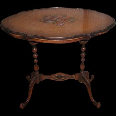Maple Side Table Birds Eye C.1905 Hand Painted: Early 1900's decorative side table has a beautiful scalloped,oval birds eye maple top with hand painted center bouquet in gorgeous coloring. The barley twist legs and feet with carving as well as the