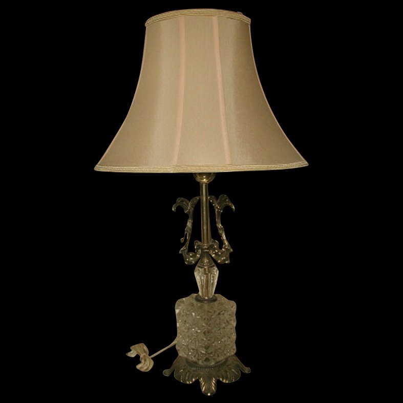 Crystal Brass Lamp Early 1900's Rewired New Silk Shade: Gorgeous early 1900's crystal and brass table lamp with new silk shade mid buff tone from Lake Shore Shades. Shade has small matching trim top and bottom with a semi-circular concave arch in the styli