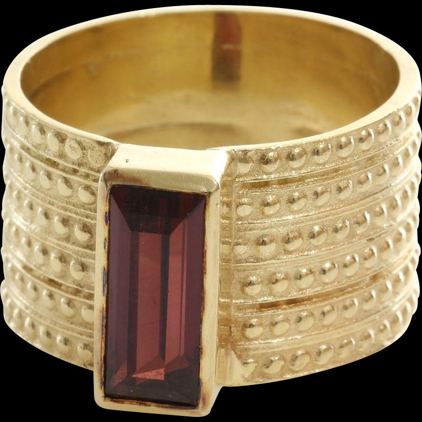 Rubellite Tourmaline Cocktail Ring | 14K Yellow Gold |: A stunning vintage rubellite tourmaline cocktail ring, in 14K gold, circa 1970's - 1980's. The beautiful solitaire, rectangular cut, tourmaline, measuring approximately 1.76 carats, has been bezel set