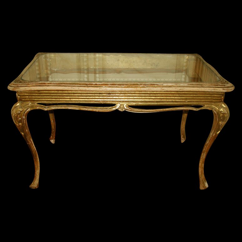 French Coffee Table 19th Century Carved Wood Glass: Small French Louis XV carved coffee table from 19th century.Removable glass top with rounded corners fits into the frame with carving at each of the four corners .Reeded apron with open work carved sw