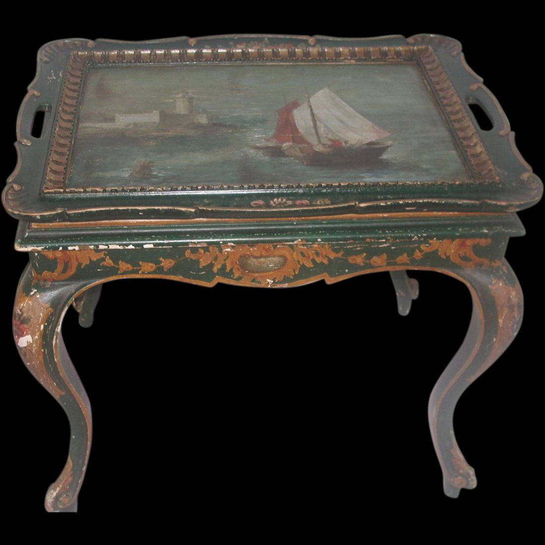 Italian Coffee Table Early 1900's Hand Painted Nautical: Handsome blue Italian coffee table with hand painted scene on the removable tray top of 2 sailing ships with a light house shown in the background. The scalloped tray has handles either side and paint
