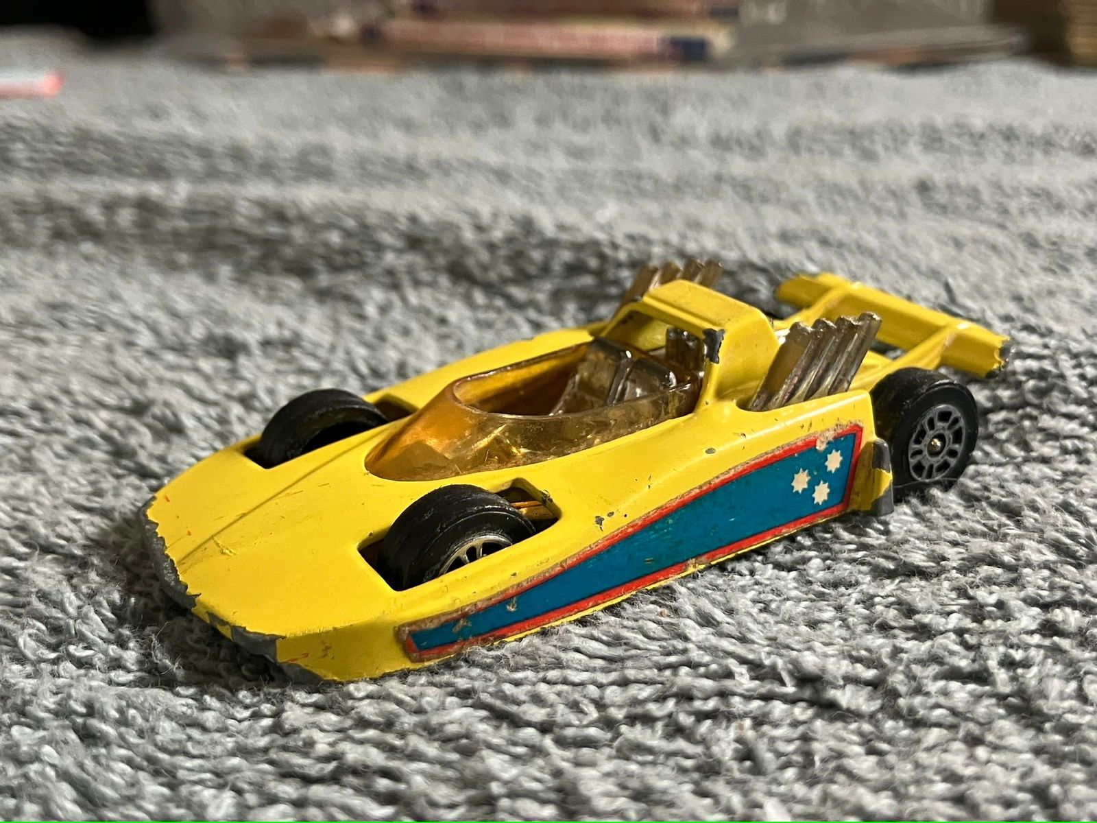 Vintage Corgi Juniors “Hot Rodder” Diecast Car – Yellow/Blue – Made in Great Britain –: The Corgi Juniors “Hot Rodder” was produced in Great Britain by Mettoy Playcraft Ltd. during the early to mid-1970s. This model features a yellow body, blue side decals with white stars, chrom