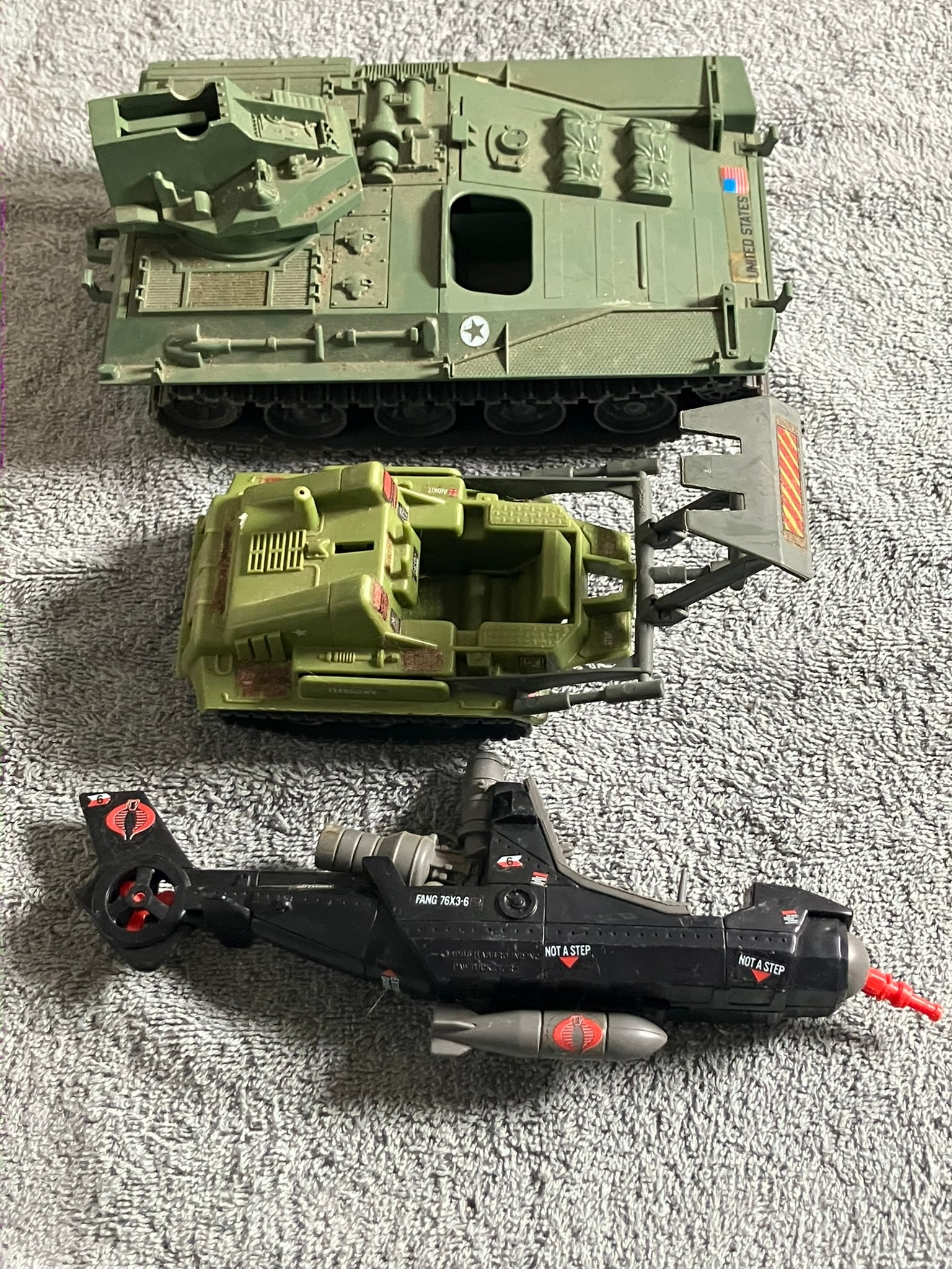 Vintage 1980s GI Joe Lot - MOBAT Tank, Armadillo, Cobra FANG Helicopter – Hasbro 1983–1985 ARAH: G.I. Joe MOBAT Tank (1983)Marking: ©1983 Hasbro, Pawtucket, R.I.Full Name: MOBAT – Motorized Battle TankDescription: U.S. green tank with motorized treads and a rotating turret (battery-operated).C