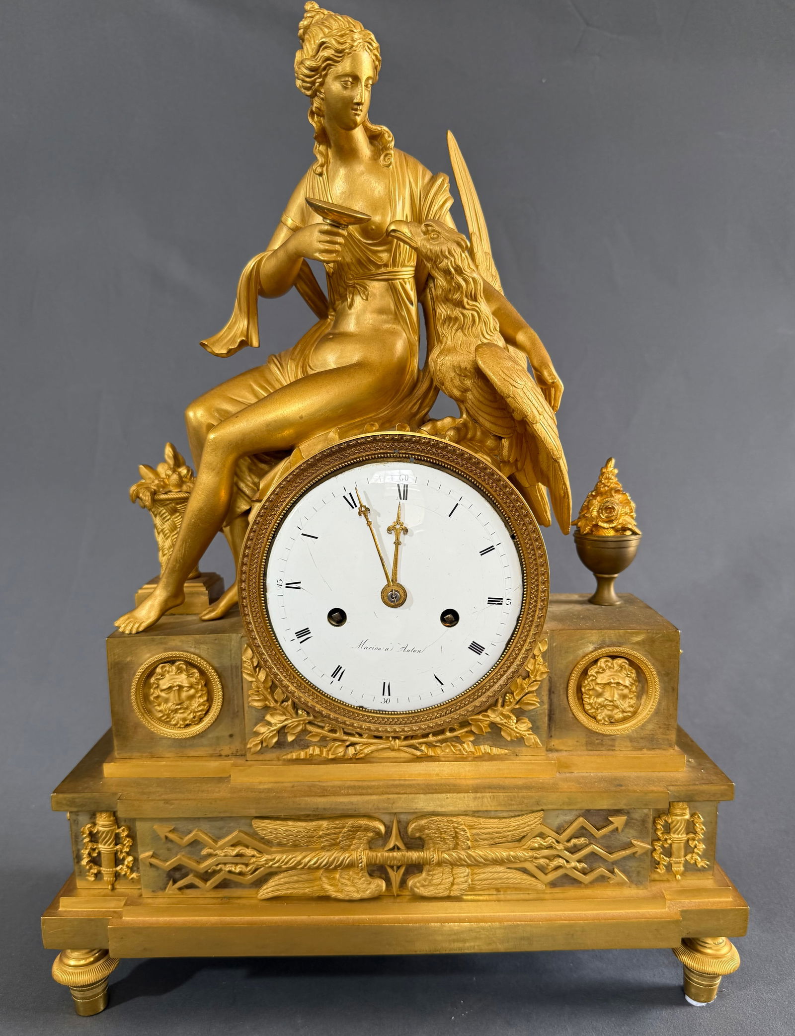 Empire Ormolu Mantel Clock Depicting Hede Goddess Of Youth Feeding Zeus c.1820: Empire ormolu mantel clock subject Hebe and the eagle of Zeus. Hebe, the goddess of youth depicted serving Zeus “ in the form of an eagle” from chalice of youth.Hebe was the cupbearer to the O