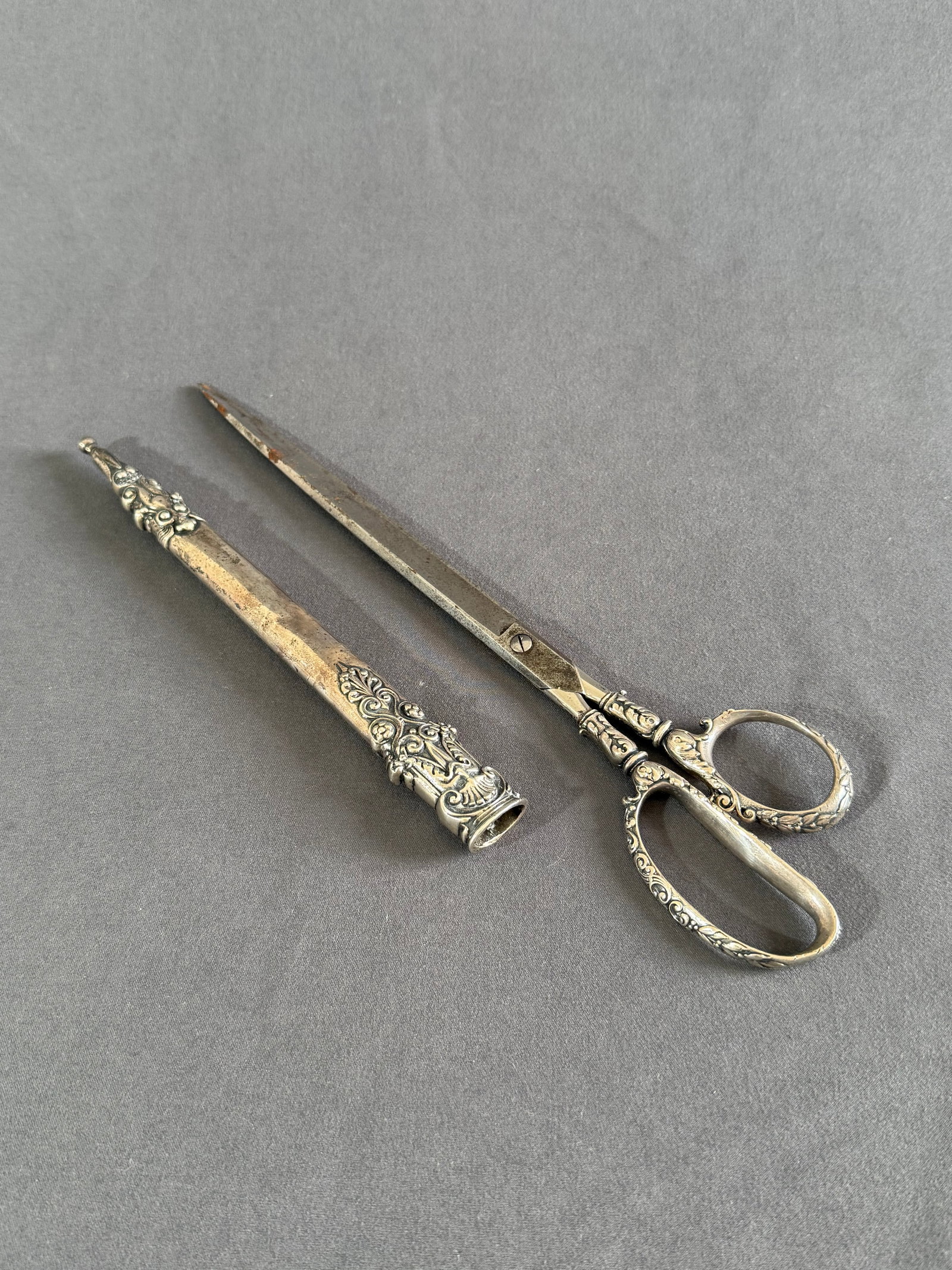 Sterling Silver scissors with matching sheath c1869 Gorham: Sterling Silver long scissors with matching sheath finely worked filigree acanthus leaves, gargoyles, flowers and nymph maidens. Gorham silversmith with German blades .10 1/4” long