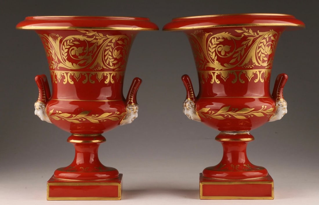 French Porcelain Campana Urns Pair .c1804: French Sevres Style Iron Red Porcelain Campana Urns marked c.1804. Fruit still life of fruits on Bacchus on the handles. 7.25”H x 5. 1/2”W.