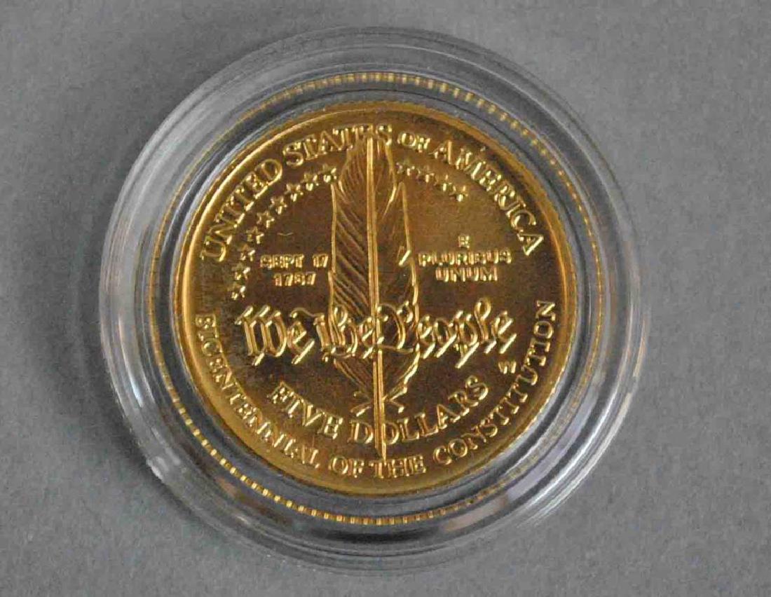 1987 UNITED STATES CONSTITUTION COIN SET: uncirculated, including a five-dollar gold coin, .900 fine (8.359gms.), and a one-dollar silver coin, .900 fine (.859ozt.)