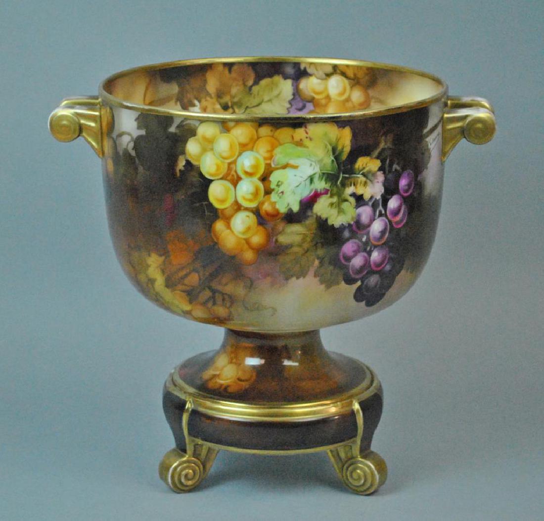 NIPPON MORIMURA HAND PAINTED PUNCH BOWL: decorated in grape and leaf motif, artist signed G. Kimura, the matching footed base as-is with interior chip, green Morimura mark on base only, some gilt wear primarily on handles, overall 12x13in.