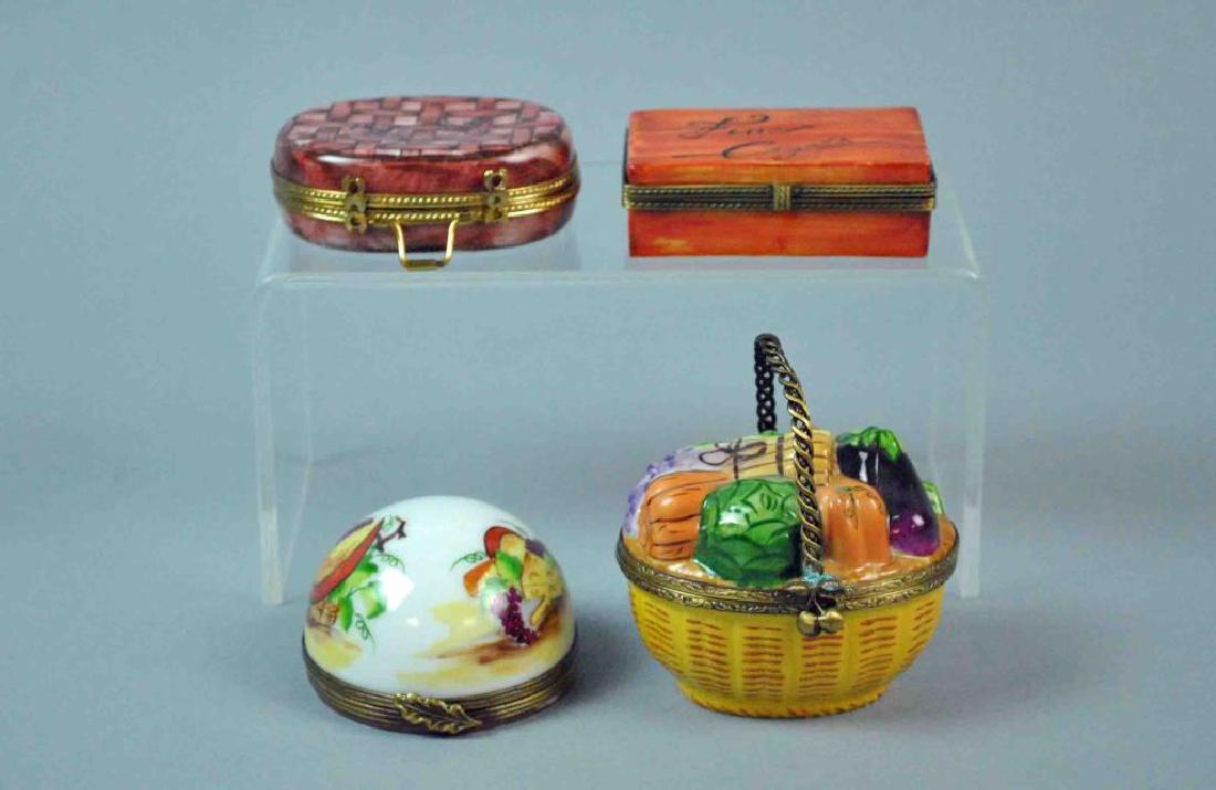 (4) LIMOGES BOXES - FOOD & CIGAR THEMED: including a vegetable basket (minor oxidation to handle), a picnic basket with chain, a cigar box (2 scant scratches to box cover), and a cheese dome opening to a sampling of cheeses, various Limoges 