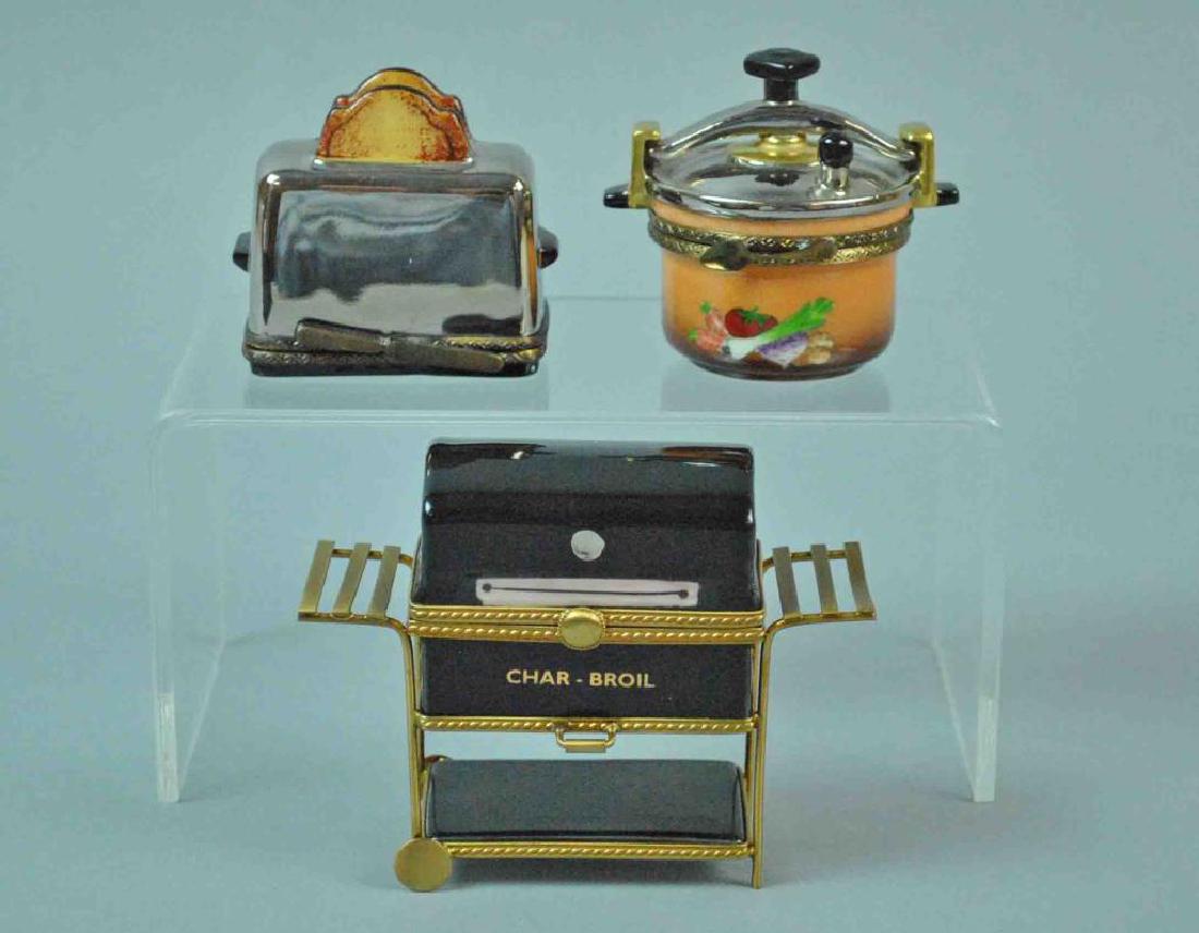 (3) LIMOGES BOXES - FOOD THEMED: including a Char Broil barbecue grill, a pressure cooker, and a toaster with toast, various Limoges marks, overall good condition, tallest 3in.