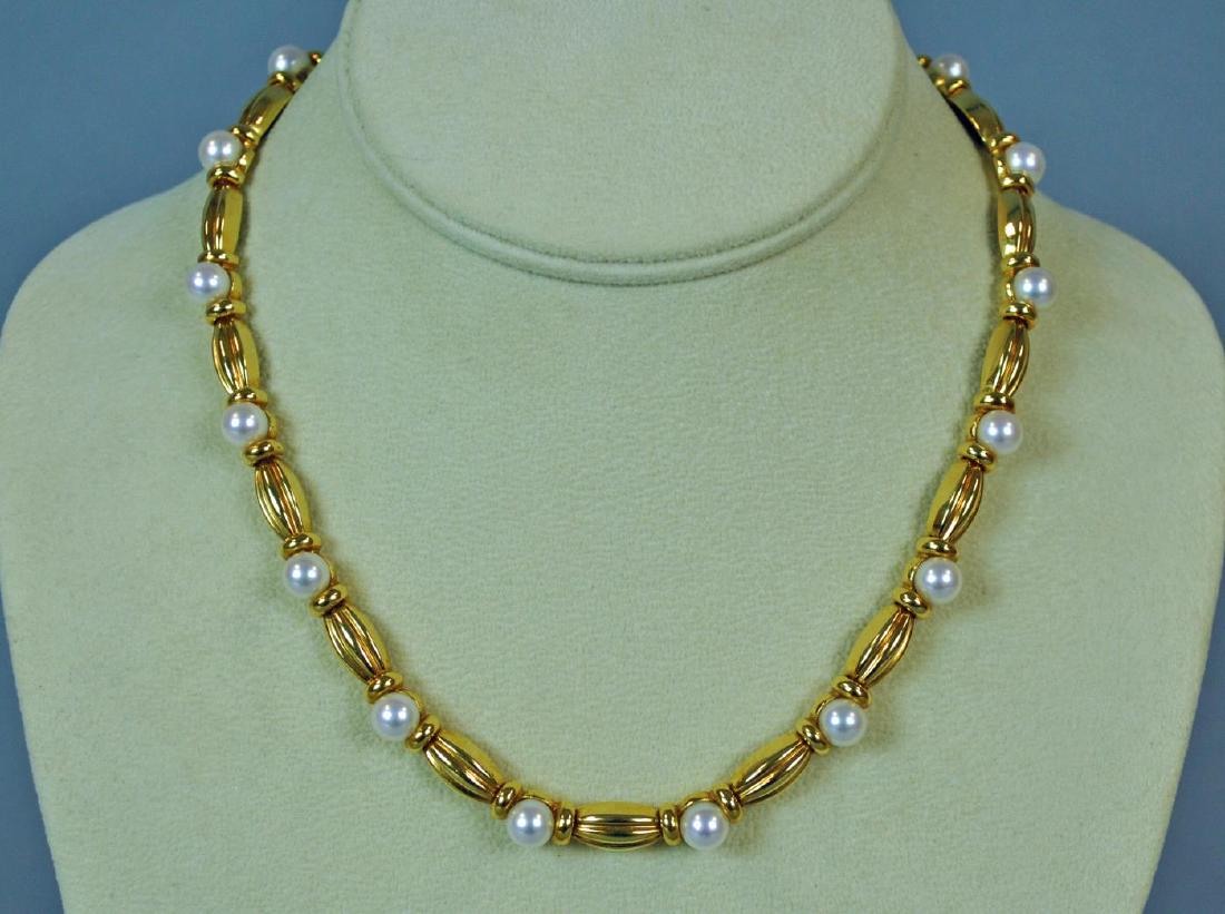 TIFFANY & CO. 18K GOLD & PEARL NECKLACE: set with 18 (6-6.5mm) cultured pearls, stamped 'Tiffany & Co. 750', safety catch, 16.5in., 71.4gms., fine condition, Opening Bid $1800