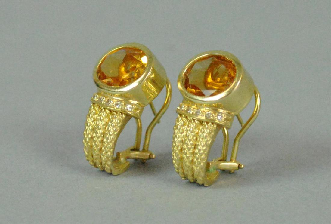 PAIR 14K GOLDEN BERYL & DIAMOND EARRINGS: each set with an oval golden beryl stone approx. 7x11mm, accented with 6 diamond melee, length 24mm, pierced type with French clip backs, in yellow textured gold stamped 585 14K, 10.5gms.