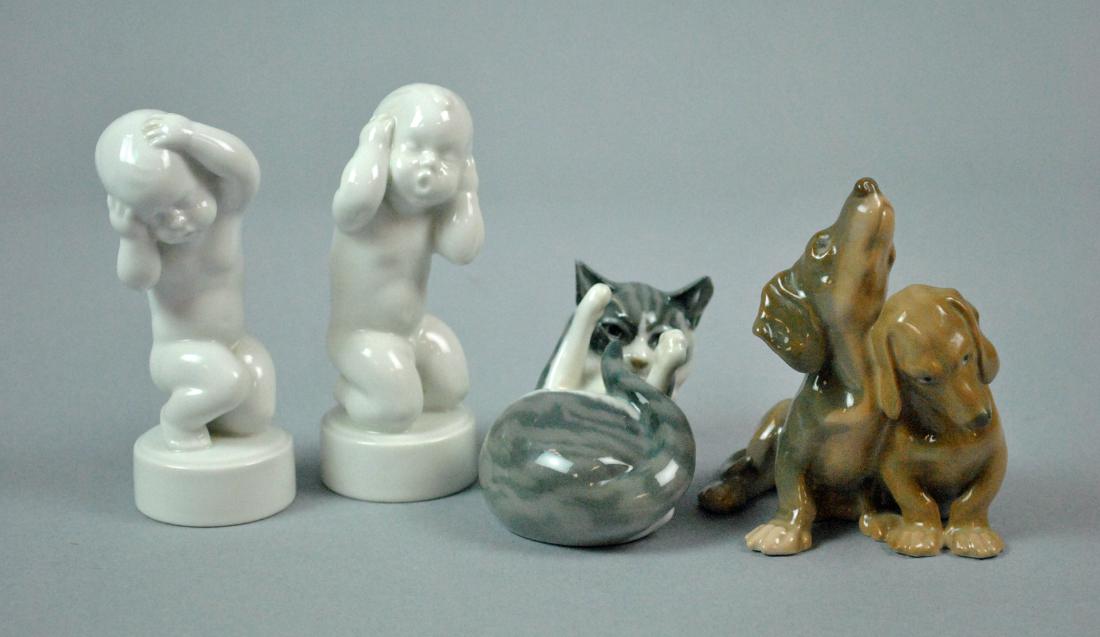 (4) PIECE COLLECTIBLES GROUP: including Bing & Grondahl Dachshunds #1805, 4in., a Royal Copenhagen Reclining Cat Playing #727, 4in., and a pair of Bing & Grondahl babies #2206 & 2209, 4.5in., no condition issues