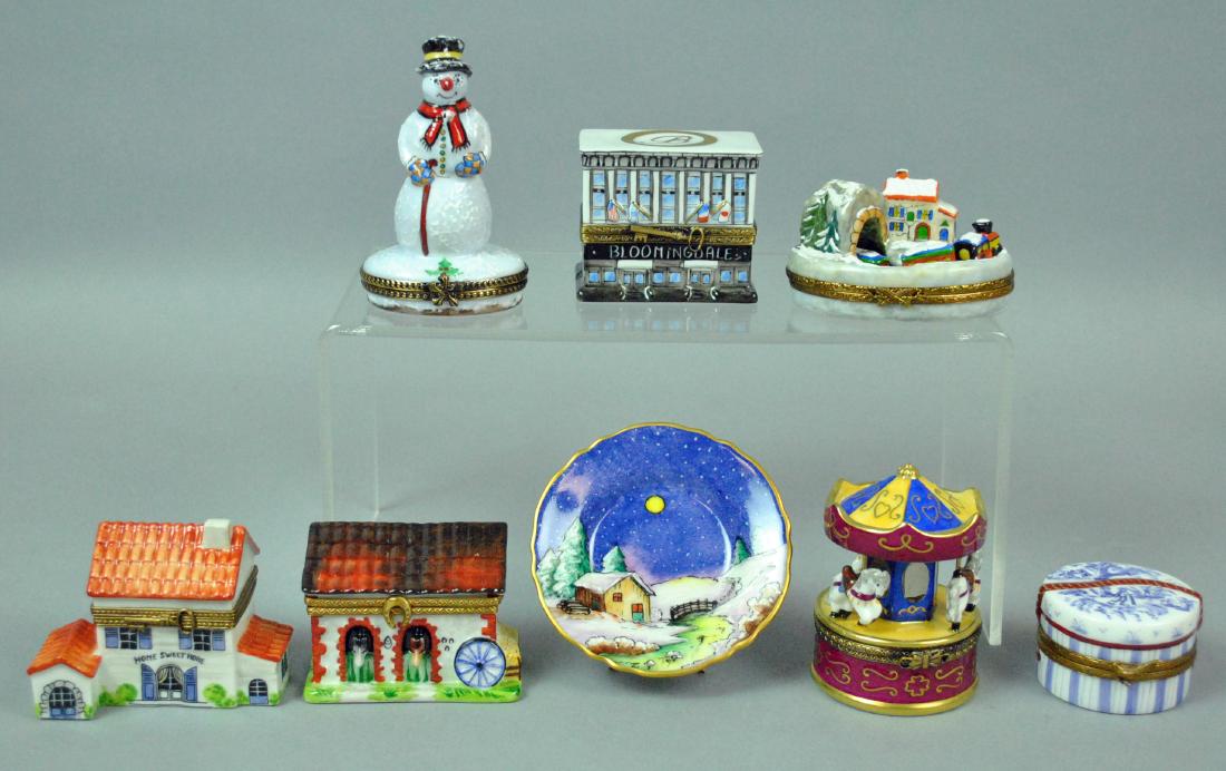 (8) LIMOGES ROCHARD PORCELAIN TRINKET BOXES: (8) LIMOGES ROCHARD PORCELAIN TRINKET BOXES including a Bloomingdales New York City building, a snowman, a toy train set, a horse stable, Home Sweet Home, a walk in the woods, Central Park Carousel, a
