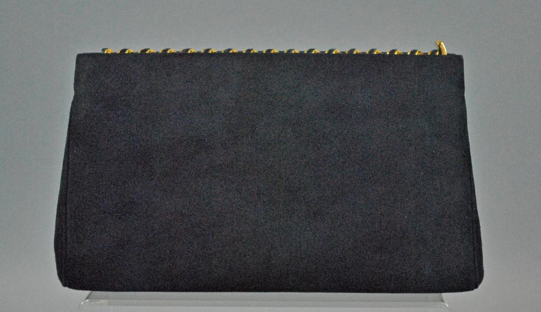 JUDITH LEIBER NAVY SUEDE CLUTCH: JUDITH LEIBER NAVY SUEDE CLUTCH purchased Saks Fifth Avenue, 1995, with original price tag, unused, side closure, front pocket with optional hidden shoulder chain, 2 interior pockets, Judith Leiber na