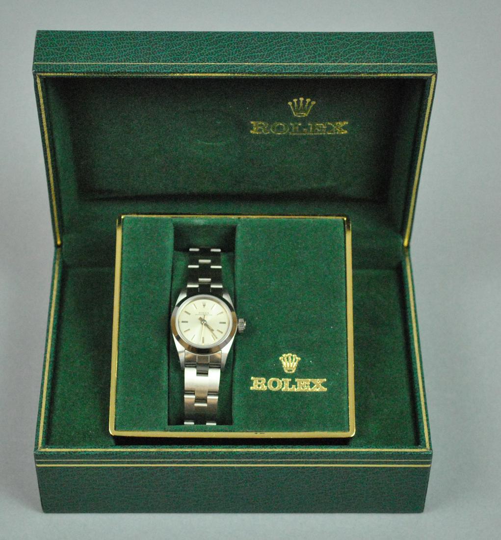 LADIES ROLEX OYSTER PERPETUAL STAINLESS WATCH: LADIES ROLEX OYSTER PERPETUAL STAINLESS WATCH 1990-1991, 25mm, dial marked 'Rolex Oyster Perpetual Swiss Made', case stamped 'Stainless Steel Original Rolex Design', and with personal engraving ("10" 