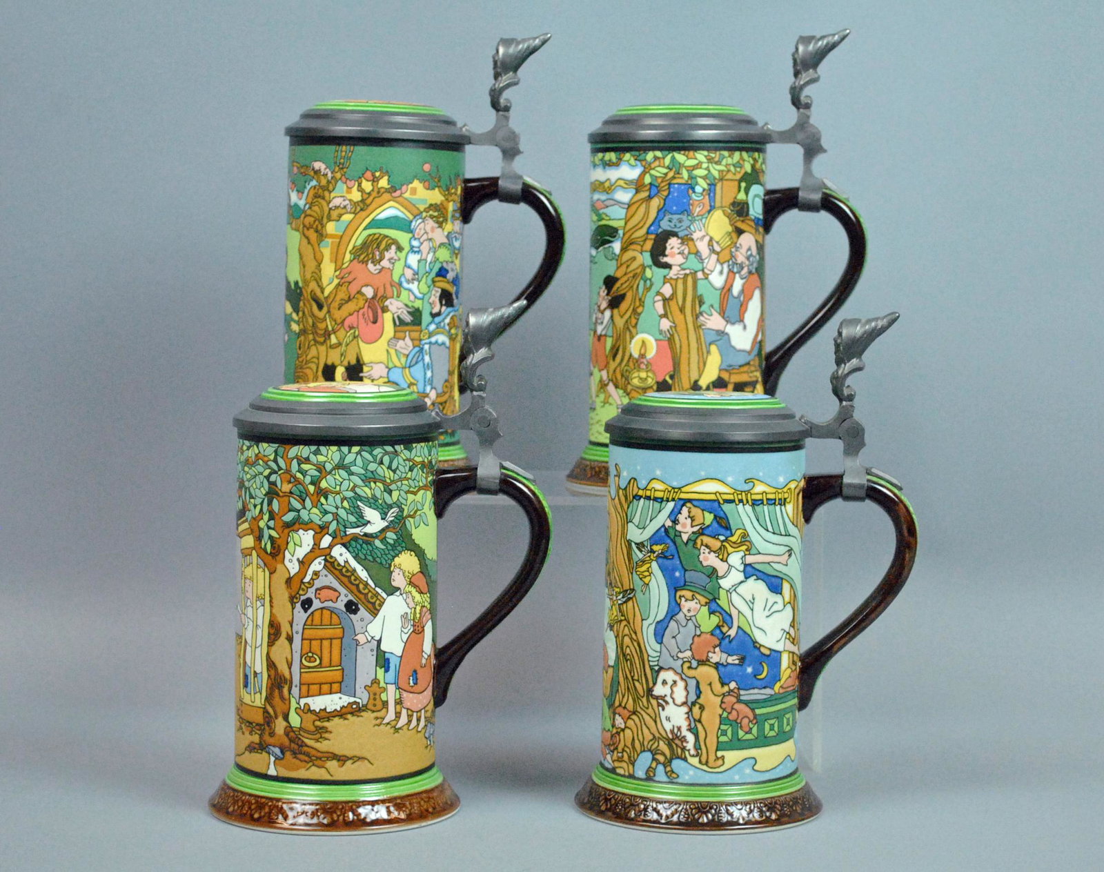 (4) METTLACH FAIRY TALE STEINS: (4) METTLACH FAIRY TALE STEINS including Hansel & Gretel, Pied Piper of Hamelin, Pinocchio, and Peter Pan, each with inlaid lid and numbered in a limited edition of 10,000, no condition issues