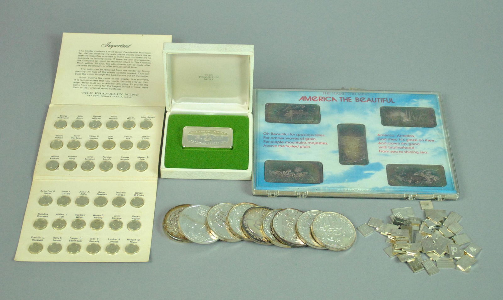 DIVERSE STERLING & 999 FINE INGOTS & MEDALS GROUP: DIVERSE STERLING & 999 FINE INGOTS & MEDALS GROUP ingots include a set of 5 packaged Hamilton Mint ‘America the Beautiful’, 5ozt. fine 999, and a Franklin Mint 1000 grain sterling Christmas 1972,