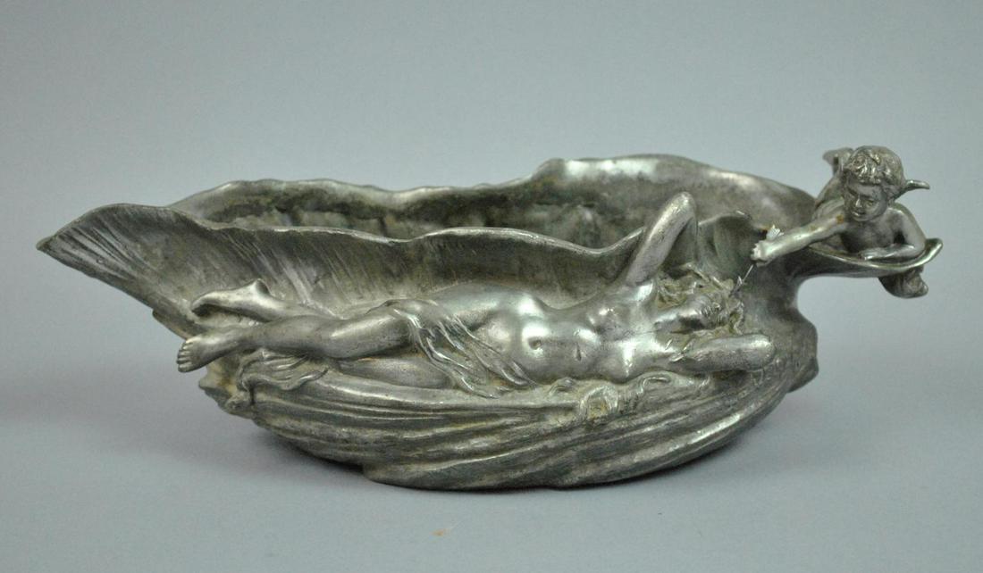 ART NOUVEAU PEWTER FIGURAL BOWL BY J. GARNIER: (French, 1853-1910), decorated in maiden and putto relief, signed beside elbow 'J. Garnier', incised at interior rim 'Etain Garanti Pur', overall good condition, typical age wear (interior oxidation),