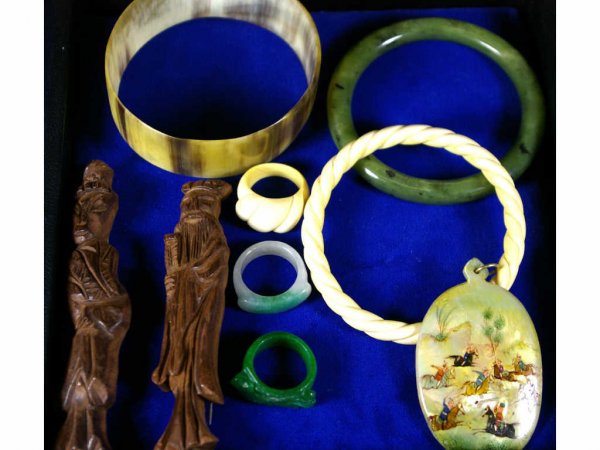 9-PIECE JEWELRY GROUP IN THE ASIAN FLAVOR: including wood, jade, abalone, and ivory examples