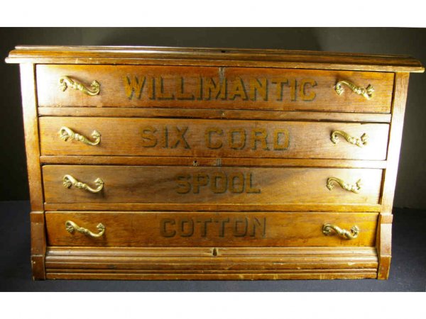 WILLIMANTIC OAK COUNTER TOP SPOOL CABINET: four-drawer with original stenciling and pulls, 15x24x16in.
