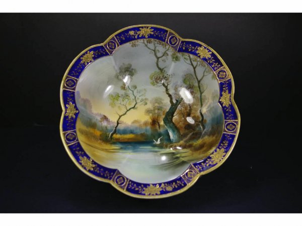NORITAKE SCENIC BOWL: hand-painted lakescape with bird and trees, shaped cobalt and gilded rim, 10in.