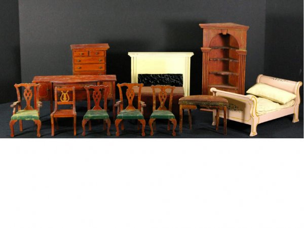 12-PIECE DOLL HOUSE FURNITURE GROUP BY TYNIE TOY: includes a corner cabinet, a sideboard, a drop-leaf dining table, four Chippendale-style dining chairs, a gate-leg games table, a sleigh bed, a fireplace mantel, and a lyre-back side chair
