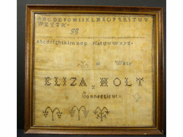1808 CONNECTICUT SAMPLER WROUGHT BY ELIZA HOLT: inscribed "Eliza Holt of Waterbury / March the 4 1808 / Eliza Holt / Connecticut", decorated with alphabets, numbers and fruit trees, pencil inscription verso reads "Worked by one of the descendants o