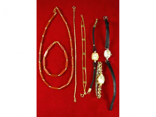 7-PIECE 14K JEWELRY GROUP: includes two Benrus watches with 14K case, one with diamond chips, a Longines with 14K case accented with diamond chips, a gold-accented necklace and bracelet set, and two chain bracelets, all marked