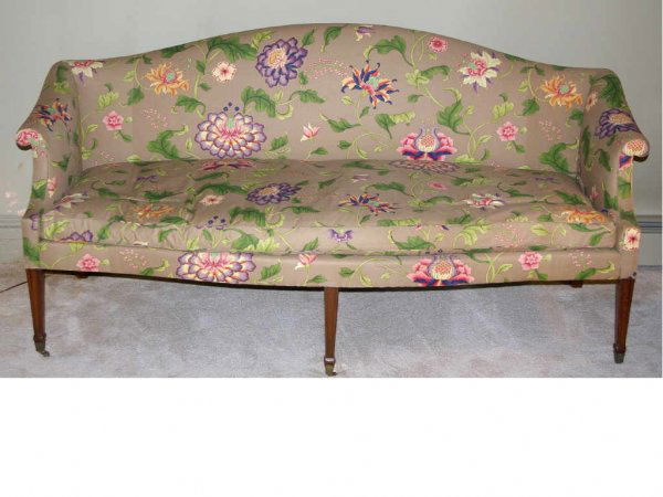 AMERICAN FEDERAL MAHOGANY SOFA: the arched back curving into demure outward scrolled arms flanking a single seat cushion, on square molded tapering legs fitted with cuffs and castors, 32x75x23in.