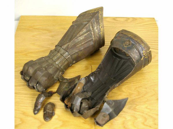 PAIR OF MEDIEVAL-STYLE STEEL GAUNTLETS: having long pointed cuffs, fully fluted, metal and leather hinge construction, riveted brass trimming, articulated fingers and thumb guards, overlapping finger-plates riveted to leathers, rounded unde